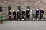 The ceremonial shoveling of dirt during the groundbreaking for the library renovation. by Harold Rau